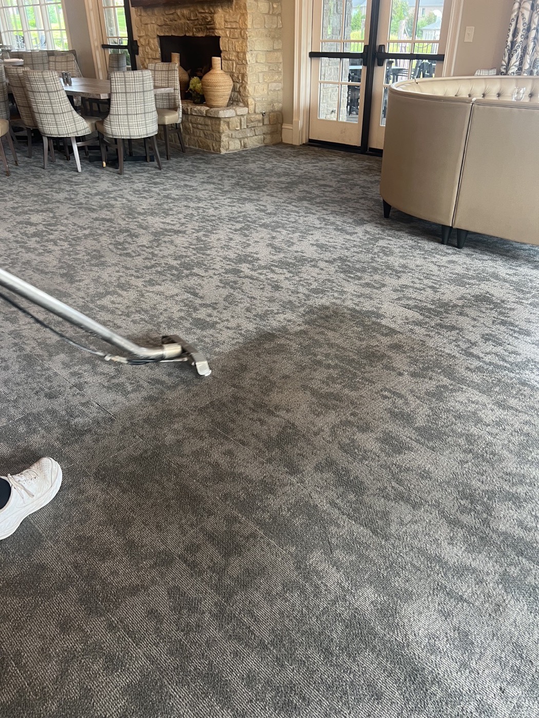 Running the extraction wand across a large room